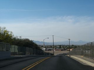 Turning northwest alongside I-40/U.S. 95, Broadway Street ascends across the BNSF Railroad line.