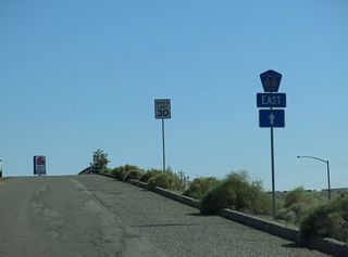CR 66 (Needles Highway) crosses I-40/U.S. 95 south.