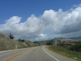 An E.G. Lewis Highway trailblazer is posted as California 41 narrows somewhat. Edward Gardner Lewis founded Atascadero as a utopian colony staring in 1915, and he built what is now California 41 (former U.S. 466) between Atascadero and Morro Bay.