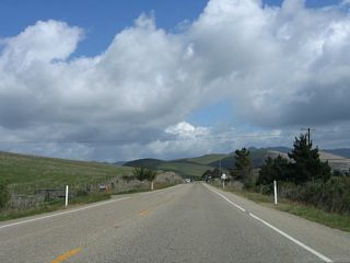 Gaining elevation to Devils Gap , the initial stretch of eastbound SR 41 (E.G. Lewis Highway) runs across rolling hills and serves local farms and ranches along the way.