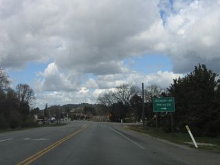 The next intersection along California 41 (E.G. Lewis Highway) east is with Santa Rosa Avenue east to Atascadero Lake and Zoo as well as U.S. 101 Exit 218A. The second intersection is with Portola Road.