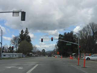 The next signalized intersection along California 41 (E.G. Lewis Highway) east is with Curbaril Avenue.