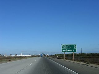 This mileage sign provides the distance to the first three exits on California 41 (Yosemite Freeway): Exit 124, North Avenue; Exit 125, Jensen Avenue; and Exit 126A, California 99 north.