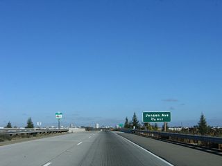 The next exit along California 41 (Yosemite Freeway) is Exit 125, Jensen Avenue (three-quarters mile; partial cloverleaf interchange).
