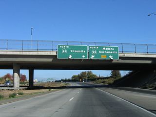 Passing under Jensen Avenue overpass, northbound California 41 (Yosemite Freeway) next approaches Exit 126A, California 99 north to Modesto, Stockton, and Sacramento. California 41 becomes the Dwight D. Eisenhower Memorial Freeway north of California 99.