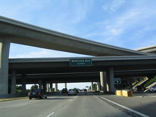 The next interchange along California 41 (Yosemite Freeway) is Exit 129, McKinley Avenue (one-half mile). The freeway passes under the California 180 stack interchange. The section of California 41 north between California 180 and Herndon Avenue was constructed in 1982.