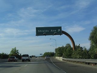 Northbound California 41 (Eisenhower / Yosemite Freeway) reaches Exit 130, Shields Avenue.