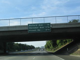 This mileage sign provides the distance to the next three interchanges along California 41 (Eisenhower / Yosemite Freeway): Exit 133, Bullard Avenue; Exit 134, Herndon Avenue; and Exit 135, Friant Road.