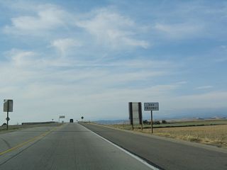 California 41 reverts to a two-lane controlled access freeway (Super Two) with no center median.