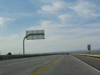 This segment of state highway has no passing lanes but would be easily upgradeable to full freeway standards if needed.