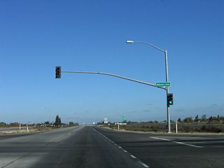 Northbound California 41 (Yosemite Freeway) meets Adams Avenue west to California 41 Business/Elm Avenue north to Easton and east to Oleander and Fowler. The business route reconnects to California 41 at American Avenue, about two-three miles north of here.