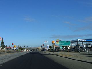 After the Interstate 5 interchange in Kings County, California 41 passes by a series of gas stations, restaurants, and motels, mostly in response to the proximity of the Interstate 5 freeway. After about a mile of motorist services on both sides of the state highway, California 41 will again enter rural Central California on a diagonal alignment toward Fresno.