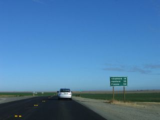 Leaving Kettleman City, this mileage sign along northbound California 41 provides the distance to Stratford (16 miles), Hanford (35 miles), and Fresno (52 miles).