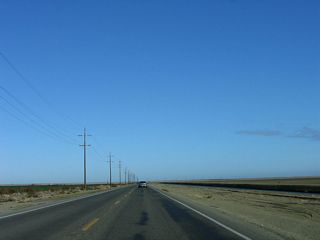 California 41 travels north of Kettleman City in a straight and flat alignment alongside a canal.
