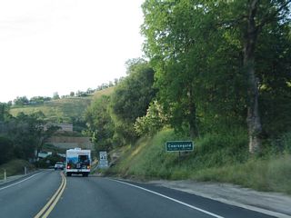 California 41 enters the unincorporated community of Coarsegold (el. 2,218 feet). The community had a population of 9,391 as of the 2000 Census and is perhaps best known for its role in the 1849 Gold Rush and Coarsegold Tarantula Festival.