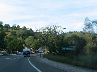 Northbound California 41 meets Road 415 (Raymond Road), which travels west to Raymond.