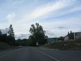 This mileage sign provides the distance to Fish Camp (12 miles), Yosemite National Park southern entrance (13 miles), and Yosemite Valley (45 miles).