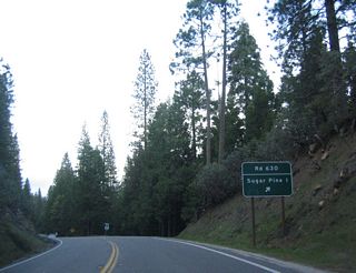 Northbound California 41 approaches Road 630 northeast to Sugar Pine (one mile).