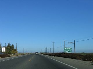 Kansas Avenue is a county road that leads east from SR 41 to Guernsey, Corcoran (20 miles), and Tulare (27 miles).