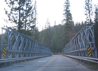 A bridge carries Wawona Road over a river.