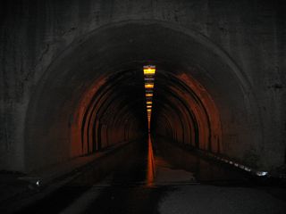 Later that evening, we approach the 4,233-foot Wawona Tunnel. This tunnel was built in 1932 and is the longest highway tunnel in California (as of 2009). Side shafts lead from the tunnel to sheer cliffs above Yosemite Valley, and these shafts serve as ventilation shafts.