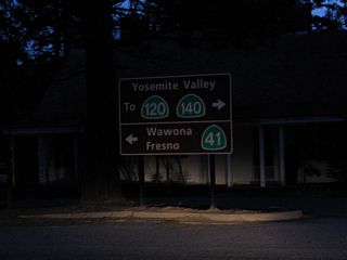 Within Yosemite National Park at the south end of Glacier Point Road where it intersects Wawona Road (in Chinqualpin Junction), this sign (placed by the National Park Service) provides directions to Wawona Road south to California 41 south to Fresno or Wawona Road north to Yosemite Valley, California 120/Big Oak Road, and California 140/El Portal Road.