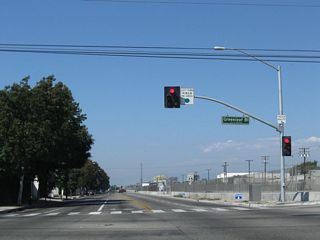 Northbound Alameda Street at Greenleaf Boulevard. In an effort to reduce noise and traffic congestion due to the major Union Pacific Railroad alignment through Compton, the Alameda Corridor project lowered the tracks into a trench that extends from just north of SR 91. This allows for minimal impacts for traffic.