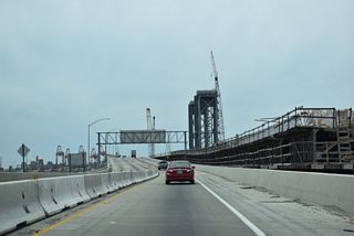 Legislatively, SR 103 ends where SR 47 overtakes the Terminal Island Freeway. The elevated roadway proceeds south across the Commodore Schuyler F. Heim Bridge into the city of Long Beach.
