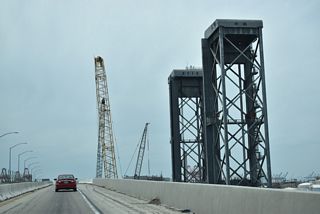 A lift bridge along the Alameda Corridor, the Henry Ford Bridge parallels the Commodore Schuyler F. Heim Bridge over Cerritos Channel.