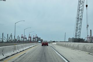 The Alameda Corridor Transportation Authority Port Access Expressway project replaced what was a lift bridge along the Terminal Island Freeway with a fixed, concrete bridge. Having opened to traffic on January 10, 1948, te former Commodore Schuyler F. Heim Bridge was functionally deficient due to heavy truck wear and closures due to lift operations.