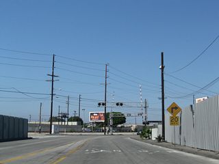SR 47 overtakes Alameda Street north from Henry Ford Avenue. Alameda Street was widened and improved to facilitate cargo movement between the ports and Interstate 405.