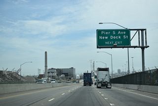 SR 47 (Ocean Boulevard) separates with I-710 at the split diamond interchange with Pier S Avenue and SR 103 (Terminal Island Freeway) north.