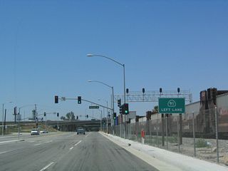 Manville Street ties into SR 47 (Alameda Street) just ahead of the ramps with SR 91 (Gardena Freeway) eastbound.