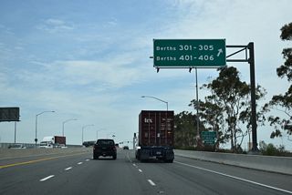 Continuing east from Ferry Street, SR 47 (Seaside Avenue) next intersects Navy Way south to Port of Los Angeles Berths 301-305 and Berths 401-406.