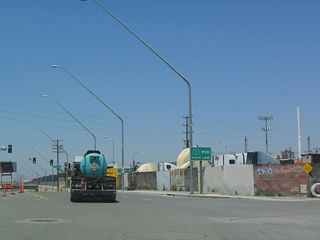 O Street connects Alameda Street with SR 1 (Pacific Coast Highway). SR 1 runs west to Torrance and Lomita and east to Long Beach.