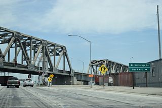 Pier A Way heads east between an oil refinery complex and the Port of Long Beach Pier A.