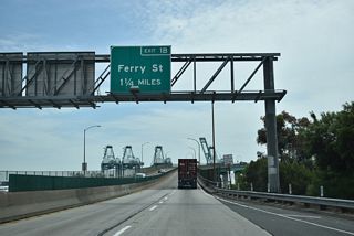 Exit 1 B departs from the east end of the Vincent Thomas Bridge to Ferry Street on Terminal Island in the Port of Los Angeles.
