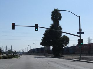 An access road links SR 47 with the 223rd Street between the viaduct over Alameda Street and the southbound entrance ramp to Interstate 405..