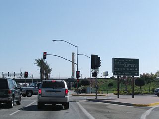 Alameda Street extends south from the city of Compton and the grade separated intersection with Artersia Boulevard as California State Route 47. Artersia Boulevar west to the entrance ramp at Acacia Avenue links Alameda Street with SR 91 (Gardena Freeway) west to Redondo Beach.