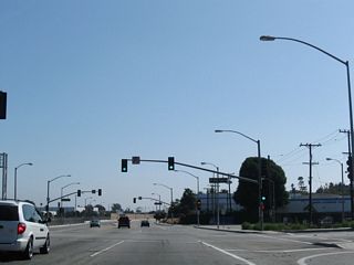 The entrance ramp to SR 91 loops away from Alameda Street and joins the Gardena Freeway ahead of Long Beach Boulevard and Interstate 710.