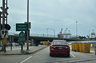 South from Pier A Way, SR 47 combines with SR 103 (Terminal Island Freeway) at a wye interchange.