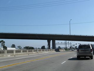 The bridge taking Alameda Street across Compton Creek includes old style bridge railing.