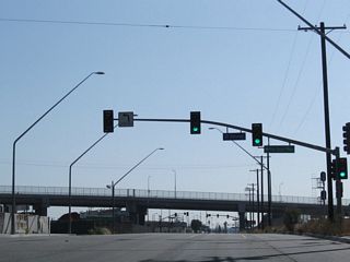 The viaduct taking SR 1 (Pacific Coast Highway) across Alameda Street and the Alameda Corridor was completed by 2004. A service road (Pacific Coast Highway) ties into SR 47 below the elevated roadway.