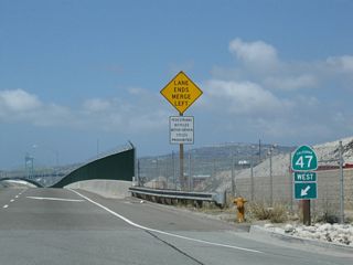 The SR 47 entrance shield along the outside lane beyond Pier S Avenue was removed by 2021.