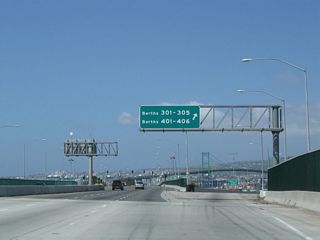 The exit for Terminal Way west and Navy Way south departs from SR 47 (Seaside Avenue). This ramp bypasses the signalized intersection joining Terminal Way and Navy Way. Historically a U.S. Naval Reservation was located to the south.