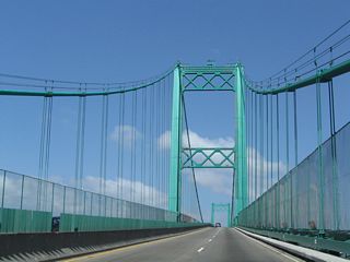 365 feet high towers support the 1,500 foot long main suspension span of the Vicent Thomas Bridge. The overall bridge length is 6,050 feet.