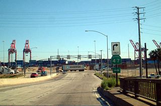Completed in 2007, a split diamond interchange was constructed in place of the at-grade intersection where the Terminal Island Freeway meets I-710 and Ocean Boulevard. SR 47 turns west along the north service road ahead of Pier S Avenue north. I-710 begins east from Ocean Boulevard.