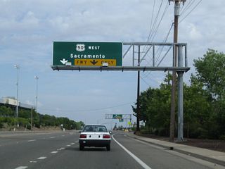 Southbound Prairie City approaches U.S. 50 (El Dorado Freeway) in Folsom. The first right connects to U.S. 50 west to Sacramento, and the second right flies over U.S. 50 to merge onto eastbound U.S. 50 en route to Placerville.