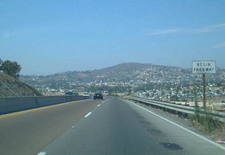 Eastbound California 54 enters Spring Valley. This narrow expressway segment has since been upgraded to full freeway status, but at the time this picture was taken, California 54 only resumed its freeway status at this point, just before the Jamacha Boulevard interchange.