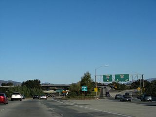 This view shows the signage for the transition ramp onto Interstate 805 north and south from eastbound California 54, both from the main lanes and from the transition ramp.